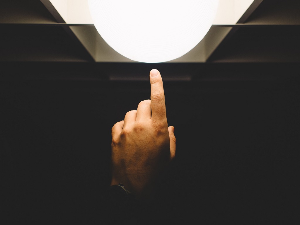 Hand, pointing to a light